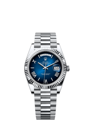 The Oyster Perpetual Day-Date 40 in platinum with a graduated blue dial, fluted bezel and President bracelet. -m228236-0024