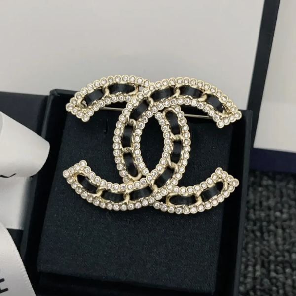 CC brooch pines